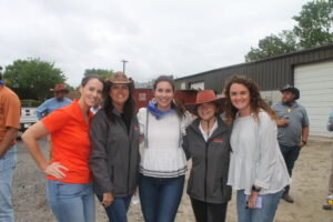 Casey Willard, Rhonda Neufess, Morgan McKnight, Ginger Blaas, and Lizie Wise participate in Rodeo Day at Trident Construction's May Superintendents Meeting.