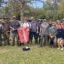 Trident team members pose together after volunteering with SCDNR & The Aquarium to restore a marsh.